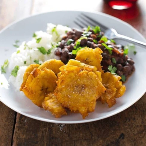 Garlic Tostones: Puerto Rican Fried Plantains With Rice And Beans Image