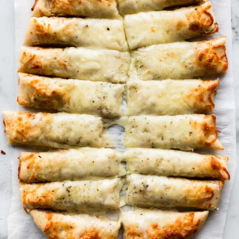 Cheesy Breadsticks Made from Pizza Dough Image