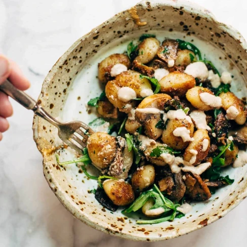 Mushroom Gnocchi with Arugula and Walnut Pesto Image