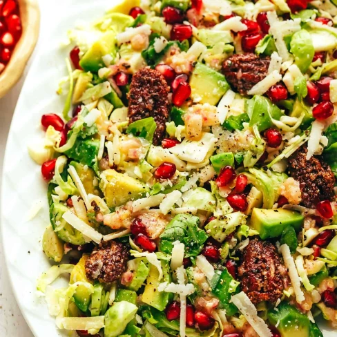 Brussels Sprouts Arugula Salad with Pomegranate and Candied Pecans Image