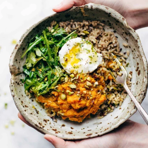 Healing Bowls With Turmeric Sweet Potatoes, Poached Eggs, And Lemon Dressing Image