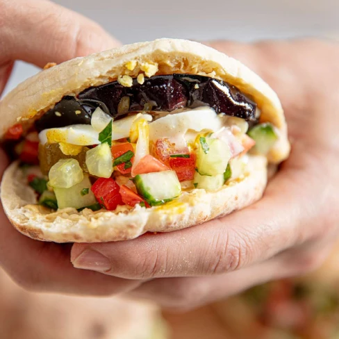 Sabich Sandwiches (Pitas With Eggplant, Eggs, Hummus, And Tahini) Image