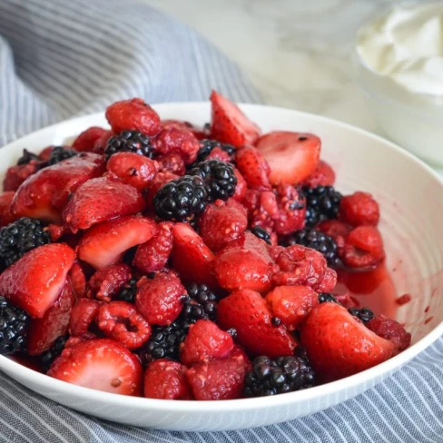 Gina Homolka&#039;s Macerated Berries with Greek Yogurt Whipped Cream Image