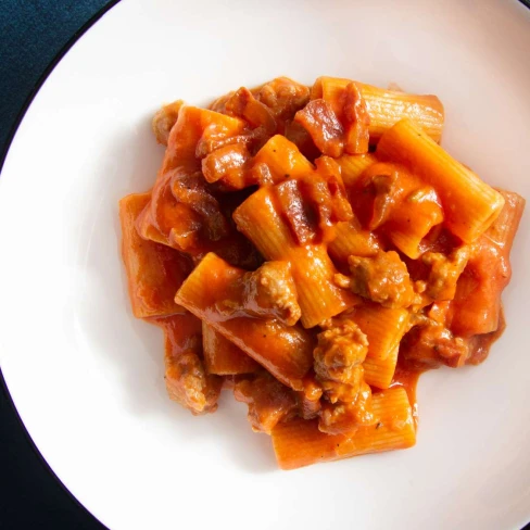 Pasta Alla Zozzona (Rigatoni With Sausage, Guanciale, And Egg Yolks) Recipe Image