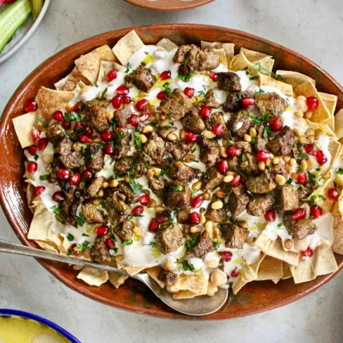 Hummus Fatteh (Hummus With Crisp Pita, Fried Meat, and Pine Nuts) Image